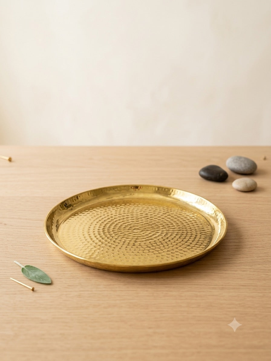Hammered copper tumbler with silver base on dining table