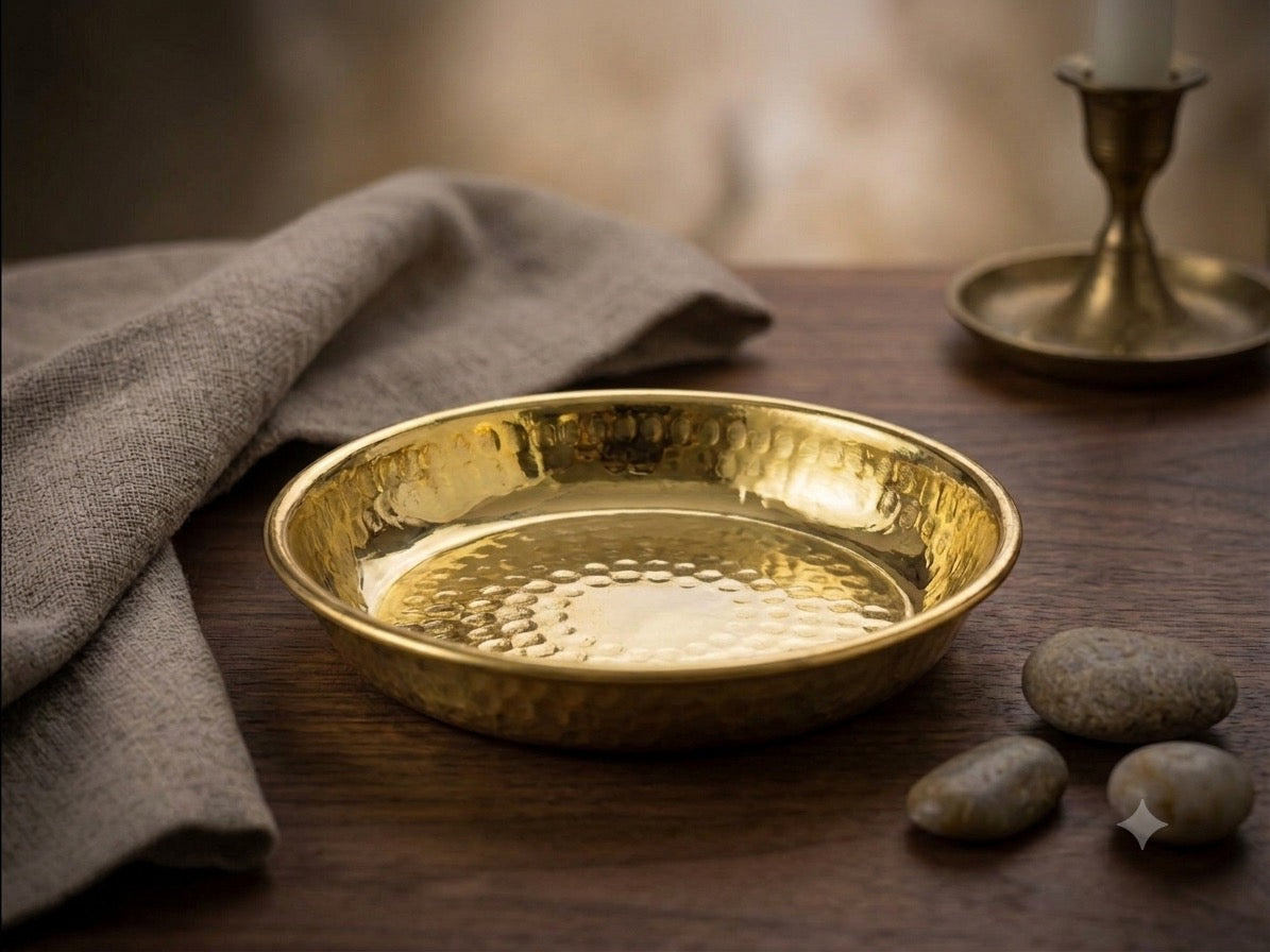 Hammered copper serving plate on wooden table